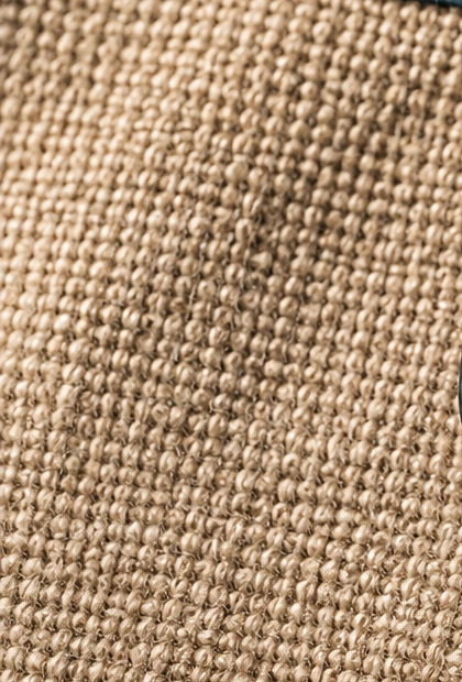 Flax woven body — a crop from the approved material photograph.